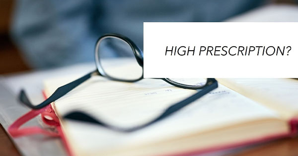 High prescription glasses on a book